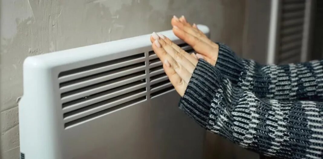 Ventilación de ambiente y artefacto de calefacción en hogar